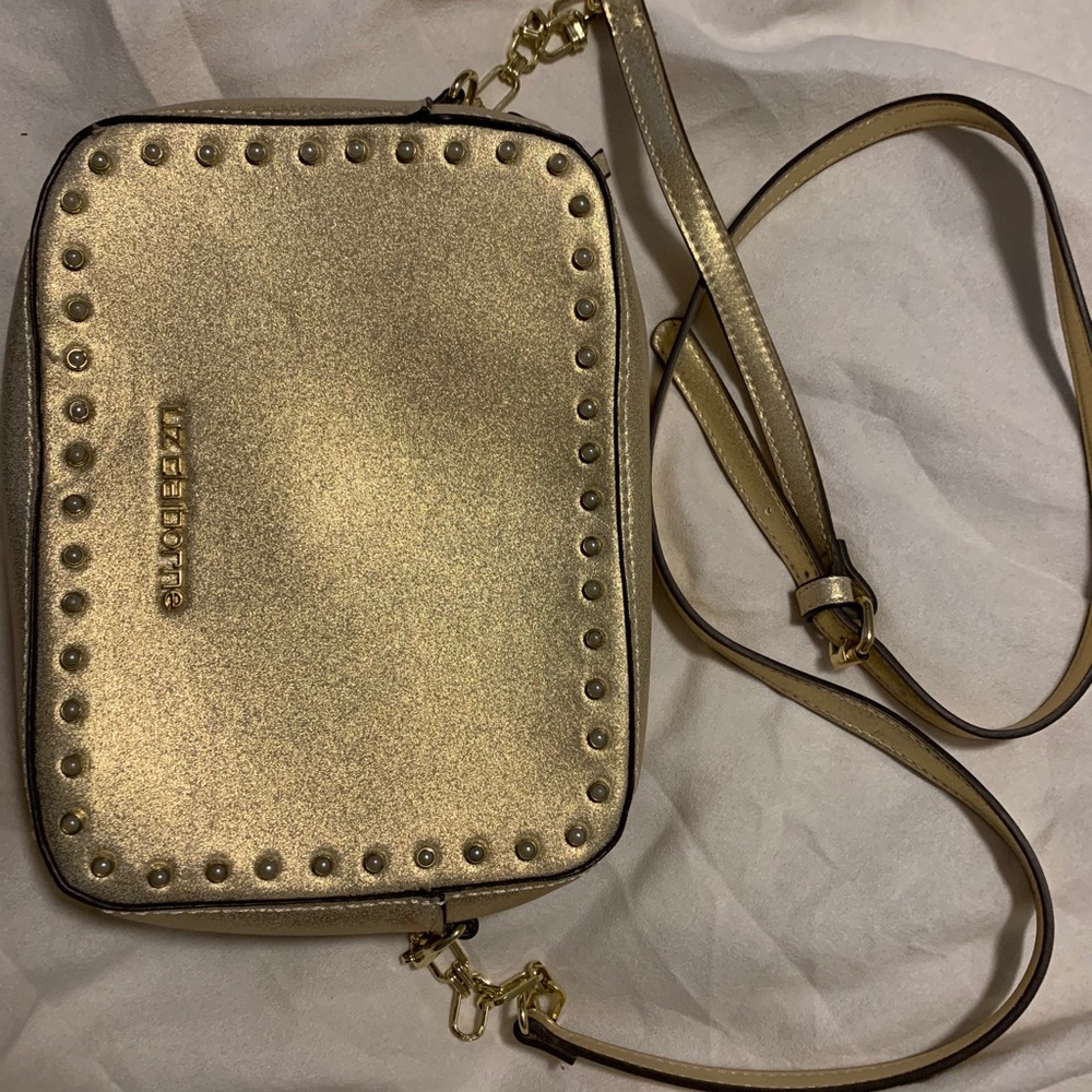 Gold colored sling purse